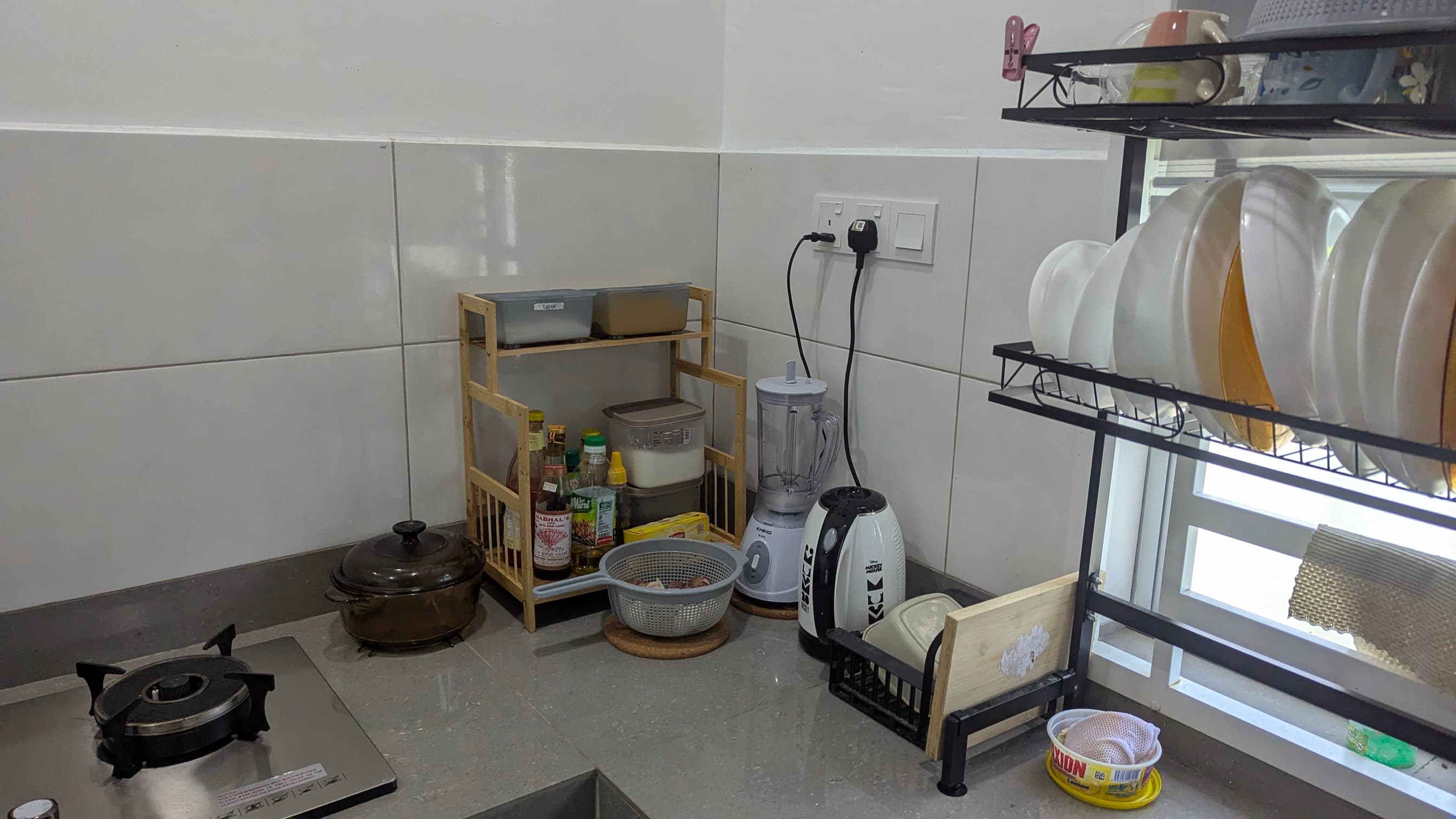 Fully equipped kitchen with modern cooking utilities and spacious cabinets at Corbett Sunshine homestay